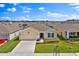 This single-Gathering home features a two-car garage and attractive landscaping at 4492 Bluff Oak Loop, Kissimmee, FL 34746