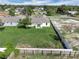 Aerial shot of the property featuring a fenced backyard and surrounding neighborhood at 4613 Madison Ave, Lake Wales, FL 33859