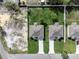 Aerial view of two identical properties with green lawns and long driveways at 4613 Madison Ave, Lake Wales, FL 33859