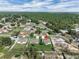 Aerial view of the neighborhood featuring a green field and several single-Gathering homes at 4613 Madison Ave, Lake Wales, FL 33859