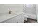 Modern bathroom featuring a white vanity, quartz countertop, and tiled shower at 4613 Madison Ave, Lake Wales, FL 33859