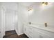 Bright bathroom features a double vanity with modern faucets and quartz countertops at 4613 Madison Ave, Lake Wales, FL 33859