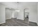 Open-concept dining area with wood floors and modern lighting at 4613 Madison Ave, Lake Wales, FL 33859