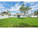 This backyard features a privacy fence and beautiful landscaping at 4615 Madison Ave, Lake Wales, FL 33859