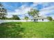 This backyard features a privacy fence and beautiful landscaping at 4615 Madison Ave, Lake Wales, FL 33859