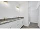 Bright bathroom boasts double sink granite vanity and marble shower at 4615 Madison Ave, Lake Wales, FL 33859