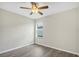 A bedroom featuring hard floors, a window, and a ceiling fan at 4615 Madison Ave, Lake Wales, FL 33859