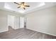 This bedroom features stylish gray flooring and multiple doorways at 4615 Madison Ave, Lake Wales, FL 33859