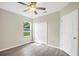 Bedroom featuring hard floors, a window, and a closet at 4615 Madison Ave, Lake Wales, FL 33859