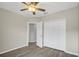 Bedroom featuring hard floors, a ceiling fan, and a closet at 4615 Madison Ave, Lake Wales, FL 33859