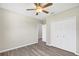This bedroom features stylish gray flooring and a closet with white doors at 4615 Madison Ave, Lake Wales, FL 33859