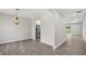 Open concept dining room with modern chandelier and archways at 4615 Madison Ave, Lake Wales, FL 33859