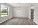 Bright dining room with a modern chandelier fixture, and a view of yard at 4615 Madison Ave, Lake Wales, FL 33859