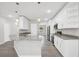 Bright kitchen featuring a large island with stone countertops, modern appliances, and new fixtures at 4615 Madison Ave, Lake Wales, FL 33859
