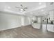 Spacious living room area featuring recessed lights, fan, and views into kitchen at 4615 Madison Ave, Lake Wales, FL 33859