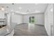 Open concept living room with recessed lighting and sliding glass doors to back yard at 4615 Madison Ave, Lake Wales, FL 33859