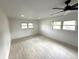 Bright bedroom with natural light, wood-look flooring, and a ceiling fan at 5249 Se 106Th Ln, Belleview, FL 34420