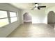 Bright living room featuring natural light, white walls, and an open floor plan at 5249 Se 106Th Ln, Belleview, FL 34420