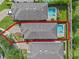 An aerial view of a house with a backyard pool, surrounded by a red line at 551 Lasso Dr, Kissimmee, FL 34747
