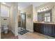 Bathroom features a toilet, large vanity, a walk-in shower, and neutral tones at 551 Lasso Dr, Kissimmee, FL 34747