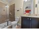 Bathroom featuring a tiled shower and granite vanity at 551 Lasso Dr, Kissimmee, FL 34747