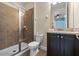 Bathroom featuring a tiled shower and granite vanity at 551 Lasso Dr, Kissimmee, FL 34747
