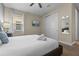 Relaxing bedroom with neutral colors, plush carpet, and a mounted television at 551 Lasso Dr, Kissimmee, FL 34747