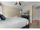 Bedroom with a mounted TV and simple decor at 551 Lasso Dr, Kissimmee, FL 34747