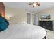 Well-lit bedroom features a full bed, television and dresser at 551 Lasso Dr, Kissimmee, FL 34747