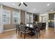 Bright dining area featuring a dark wood table with patterned chairs and natural light at 551 Lasso Dr, Kissimmee, FL 34747