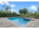 Inviting backyard pool with a clear blue water and lush landscaping at 551 Lasso Dr, Kissimmee, FL 34747