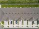 Aerial view of the townhome community with parking spaces at 7685 Stone Creek Trl, Kissimmee, FL 34747