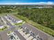 Aerial view of townhomes nestled next to green space, highlighting a serene location at 7685 Stone Creek Trl, Kissimmee, FL 34747