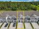 Aerial view of townhomes with private driveways, showcasing modern community living at 7685 Stone Creek Trl, Kissimmee, FL 34747