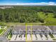 Aerial view of townhomes surrounded by lush trees, showcasing community living at 7685 Stone Creek Trl, Kissimmee, FL 34747