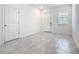 An entryway featuring neutral paint, tile floors and a front door at 7685 Stone Creek Trl, Kissimmee, FL 34747