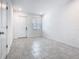 View of the entryway with tiled floors, a front door, and a window providing natural light at 7685 Stone Creek Trl, Kissimmee, FL 34747