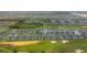 Aerial view showing the community's layout, including townhomes, golf course, and recreational areas at 783 Ocean Course Ave, Davenport, FL 33896