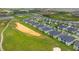 Aerial view highlighting townhomes, a nearby golf course, lakes, and a well-planned community at 783 Ocean Course Ave, Davenport, FL 33896