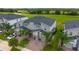 Aerial view of townhomes, highlighting landscaping, proximity to the golf course, and neighborhood layout at 783 Ocean Course Ave, Davenport, FL 33896