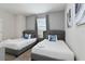 Inviting bedroom with twin beds, plush headboards, and ambient lighting at 783 Ocean Course Ave, Davenport, FL 33896