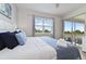 Bedroom featuring a bed, large window with golf view, and a sliding glass door to a balcony at 783 Ocean Course Ave, Davenport, FL 33896