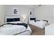Cozy bedroom featuring twin beds, soft lighting, and modern decor at 783 Ocean Course Ave, Davenport, FL 33896