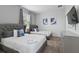 Comfortable bedroom featuring two beds, soft carpet, and stylish decor at 783 Ocean Course Ave, Davenport, FL 33896