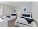 Bright bedroom with twin beds and contemporary geometric wall art at 783 Ocean Course Ave, Davenport, FL 33896