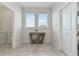 Bright entryway featuring tile floors, a modern console table, and natural light from two windows at 783 Ocean Course Ave, Davenport, FL 33896