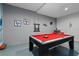 Finished basement featuring a pool table with red felt, and colorful wall decorations and music theme at 783 Ocean Course Ave, Davenport, FL 33896