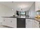 Modern kitchen featuring gray countertops, stainless steel appliances and open view to dining and living rooms at 783 Ocean Course Ave, Davenport, FL 33896