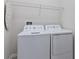 Functional laundry room with modern washer and dryer units at 783 Ocean Course Ave, Davenport, FL 33896
