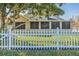 Fenced backyard with a covered patio offering a peaceful outdoor space at 7922 Elmstone Cir, Orlando, FL 32822